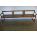 An Arts and Crafts oak bench, 229cm wide, 73cm tall, 38cm deep