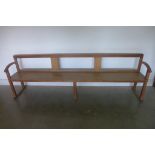 An Arts and Crafts oak bench, 229cm wide, 73cm tall , 40cm deep
