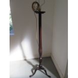 A Georgian mahogany standard lamp with shaped and reeded column, enhanced with carved wheat ears,