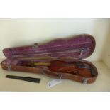 A violin with a one piece 14 1/4 inch, 36cm single piece back with a theador Berger 1923 label,