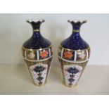 A pair of Royal Crown Derby Imari pattern vases, 25cm tall, one vase tap repaired, other vase has