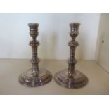 A pair of weighted silver candlesticks, 17cm tall, London 1958/59 - generally good, some rubbing