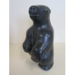 An Inuit carved stone standing polar bear, 26cm tall, dated 1976 with Eskimo art label