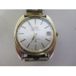 A gold plated Omega constellation automatic gents wristwatch, with date on a plated strap, not