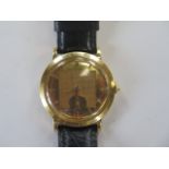 An 18ct yellow gold manual wind Movado gents wristwatch on a leather strap, 37mm wide, approx