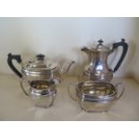 A silver three piece tea set with a matching plated water pot, Sheffield 1924/25 maker GH, silver