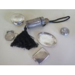 A silver ladies opera case, a silver match case, a small dish, two round containers and a white