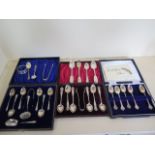 Two silver boxed spoon sets, and other silver flatware, two napkin rings , total weight approx 12