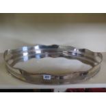 An oval silver plated tray with a pierced shaped rim, 59cm x 41cm