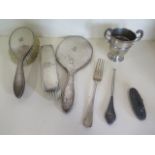 A three piece silver dressing set, a silver fork, silver cup, nail buff and boot hook, weighable