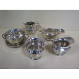 Two silver milk jugs, a silver sauce boat, a silver pot and a silver twin handled bowl, total weight