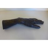 A bronze casting of a death hand, dated 1886-1978, 20cm long