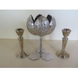 A pair of weighted silver candlesticks, 11cm tall, and Eastern low grade silver embossed tulip stand