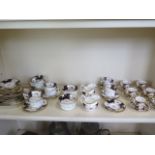 A Coalport part tea service, six Coalport coffee cans of similar design