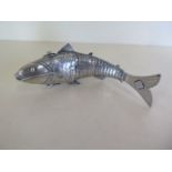 An Eastern articulated white metal fish with hinged head, 16cm long, approx 2 troy oz, missing a