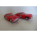 A near pair of Tri-ang Scalextric Aston Martin DB4 GT MM/C.68 numbers 6 and 8 not tested, one with