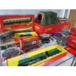 A Hornby OO gauge rolling stock, buildings , track and two locos, Battle of Britain 4-6-2 and GWR