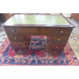 A 19th century mahogany one piece six drawer desk with a leather inset top, 75cm tall x 110cm x 57cm