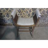 An Edwardian line inlaid mahogany stool