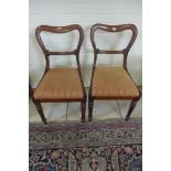 A pair of 19th century rosewood side chairs, with slip in seats