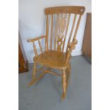 A modern Victorian style beech rocking chair, in good polished condition