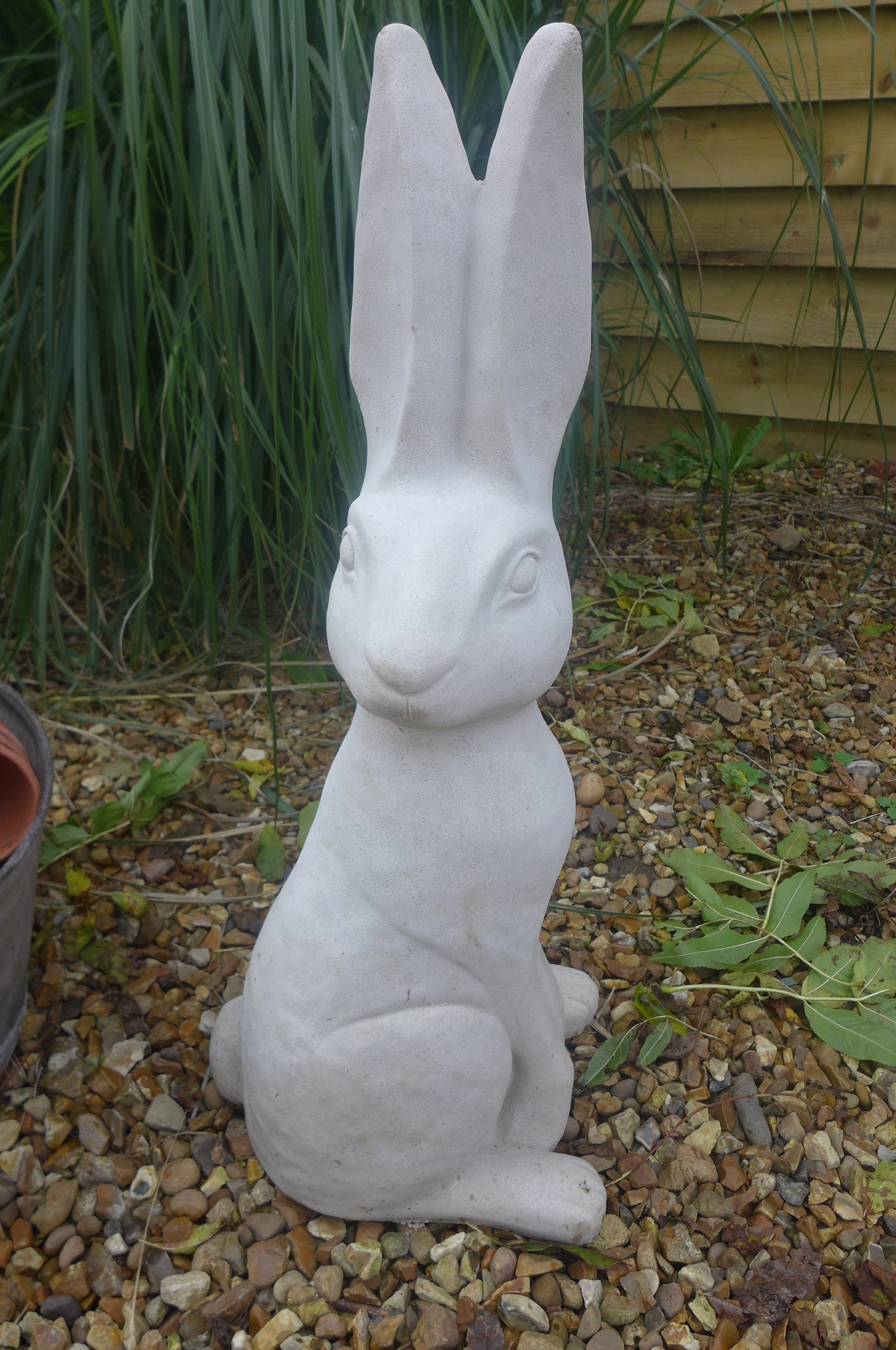 A large cast stone figure of a seated hare, 28cm W x 64cm H