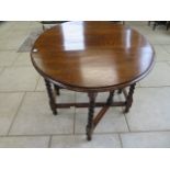 An oak barley twist gate leg table - 73cm h x 91cm x 119cm extended, in good condition