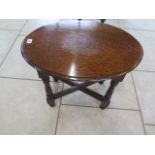 An oak oval top side table, 51cm tall x 62cm x 45cm - in good condition