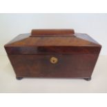 A late Georgian sarcophagus shape mahogany three section tea caddy, standing on bun feet, in clean