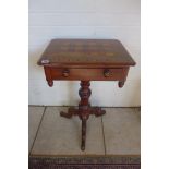 A Victorian mahogany work table on a carved tripod base with an inlaid top, 76cm tall x 48cm x 37cm