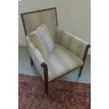 A recently re-upholstered Edwardian mahogany armchair