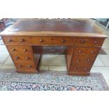 A late Victorian mahogany nine drawer twin pedestal desk, 74cm tall, 122cm x 68cm