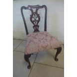 A 19th century mahogany side chair, with an entwined vase shaped splat, on carved cabriole legs