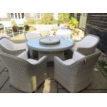 A Bramblecrest Monte Carlo dining set, 140cm round table, lazy Susan, six armchairs and 3metre