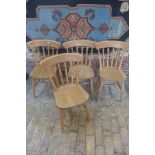 A set of four beech kitchen chairs