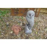 A life size cast stone sculpture of a barn owl, 41cm high, together with an Art Nouveau style wall