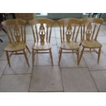 A set of four modern beech lyre back kitchen chairs, in good clean polished condition