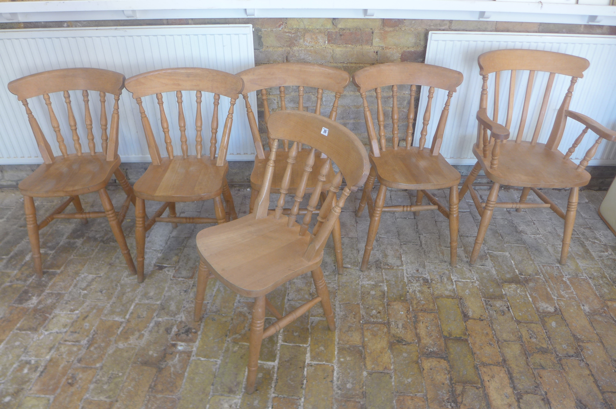 A set of six beech wood dining kitchen chairs, including a carver