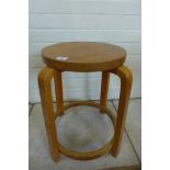 A bent wood laminated stool in the style of Alvar Aalto, 48cm tall, seat 32cm diameter