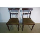 A pair of 18th century dining chairs with carved and reeded centre rails, turned/reeded front legs