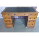 A Victorian twin pedestal oak nine drawer desk, 78cm tall x 135cm x 71cm - missing its gallery
