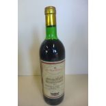 A bottle of 1973 Chateau Le Tour Capet grand Cru St Emilion red wine - level to base of neck