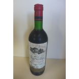 A bottle of 1977 Chateau La Blanquerie Bordeaux Superior Marcel Rougier red win - level to base of