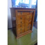 A late Victorian mahogany twelve drawer table top collectors cabinet, with a glazed door, 41cm H x