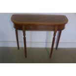 A walnut D shaped hall table with a single drawer on turned legs, made by a local craftsman to a
