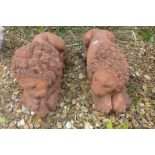A pair of cast stone terracotta recumbent lions on rectangular bases, after canova, 45cm L x 19cm H
