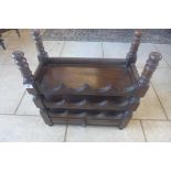 An oak twelve bottle wine rack with a drawer, 57cm tall x 52cm x 24cm