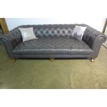 An ex-display Alexander and James Vivienne Grey soft leather Chesterfield, three seat sofa, 232cm