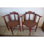 A pair of Edwardian mahogany inlaid tub shape chairs