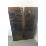A pair of Art Deco glazed mahogany cabinets, with adjustable shelves, 157cm H x 52cm x 28cm
